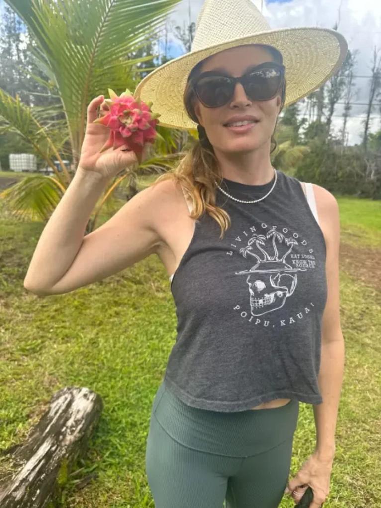 Sharon holding dragon fruit at Island Boundary Homestead